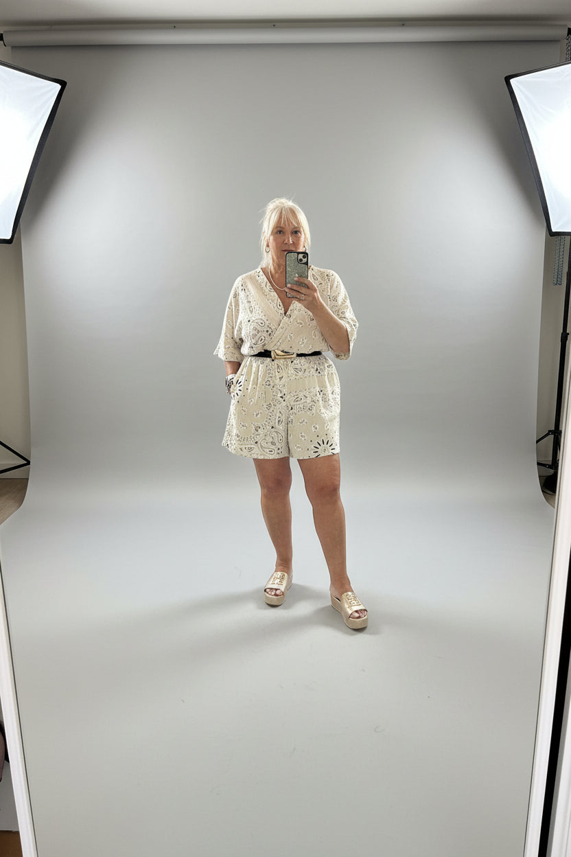 Woman taking a mirror selfie wearing a Millie Playsuit