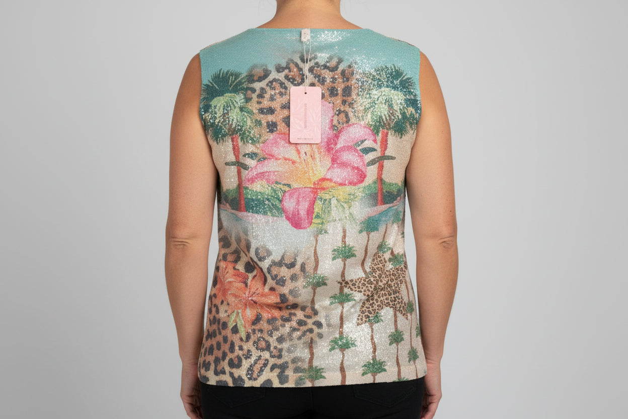 Person wearing a sleeveless top with floral and leopard print design on a plain background