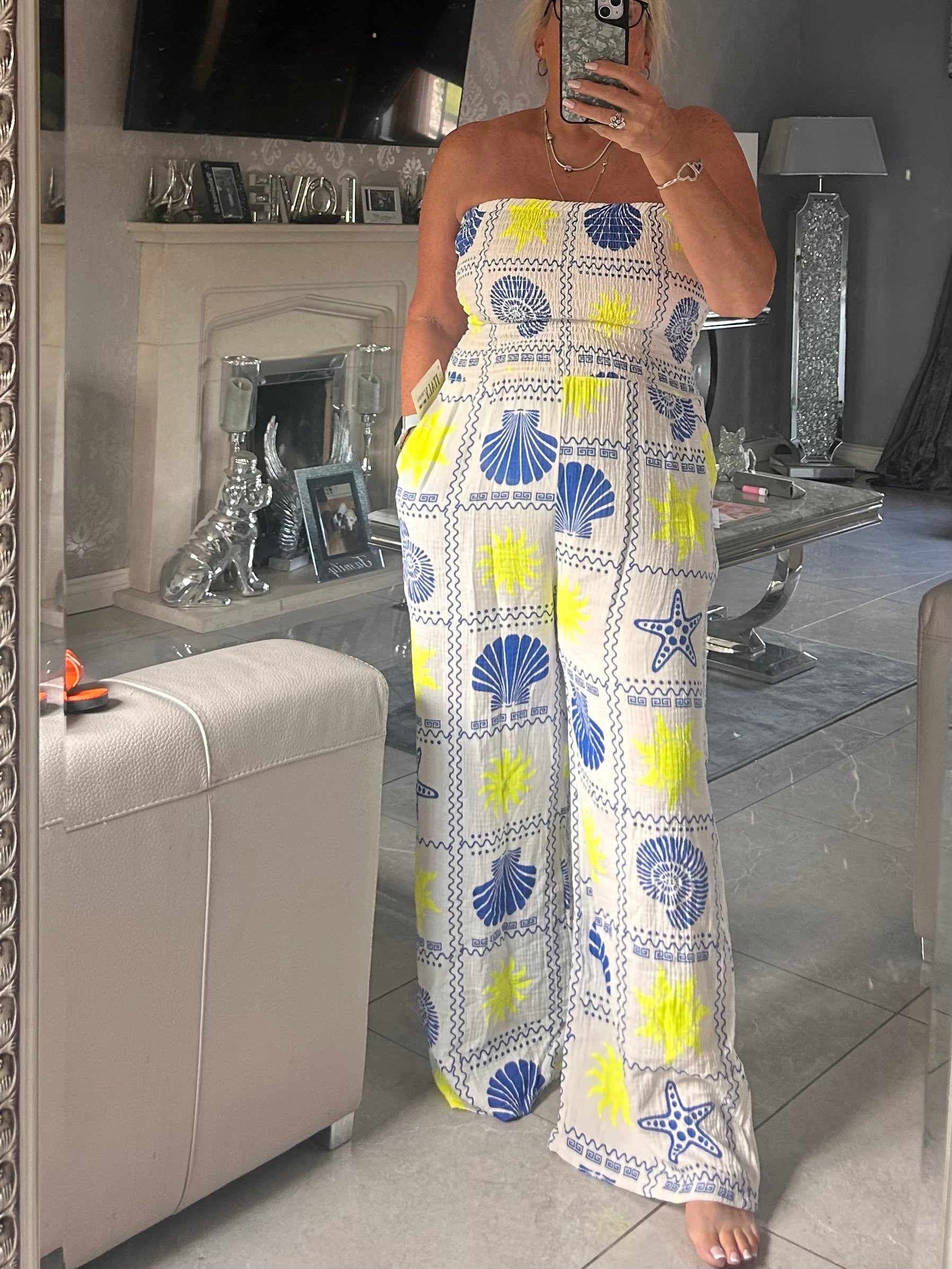 women wearing a jumpsuit taking a selfie