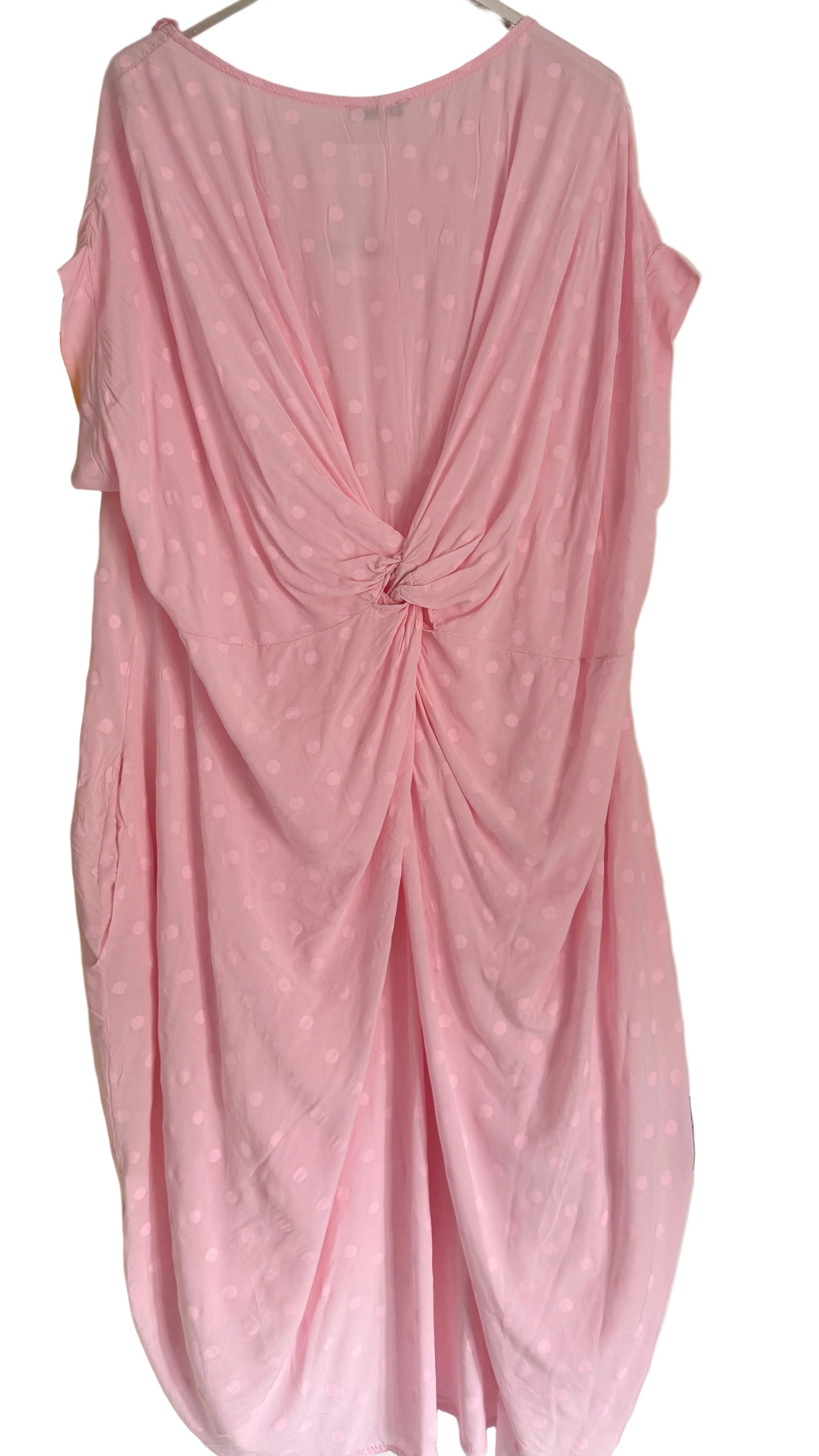 Pink dress with a knot detail on a white background