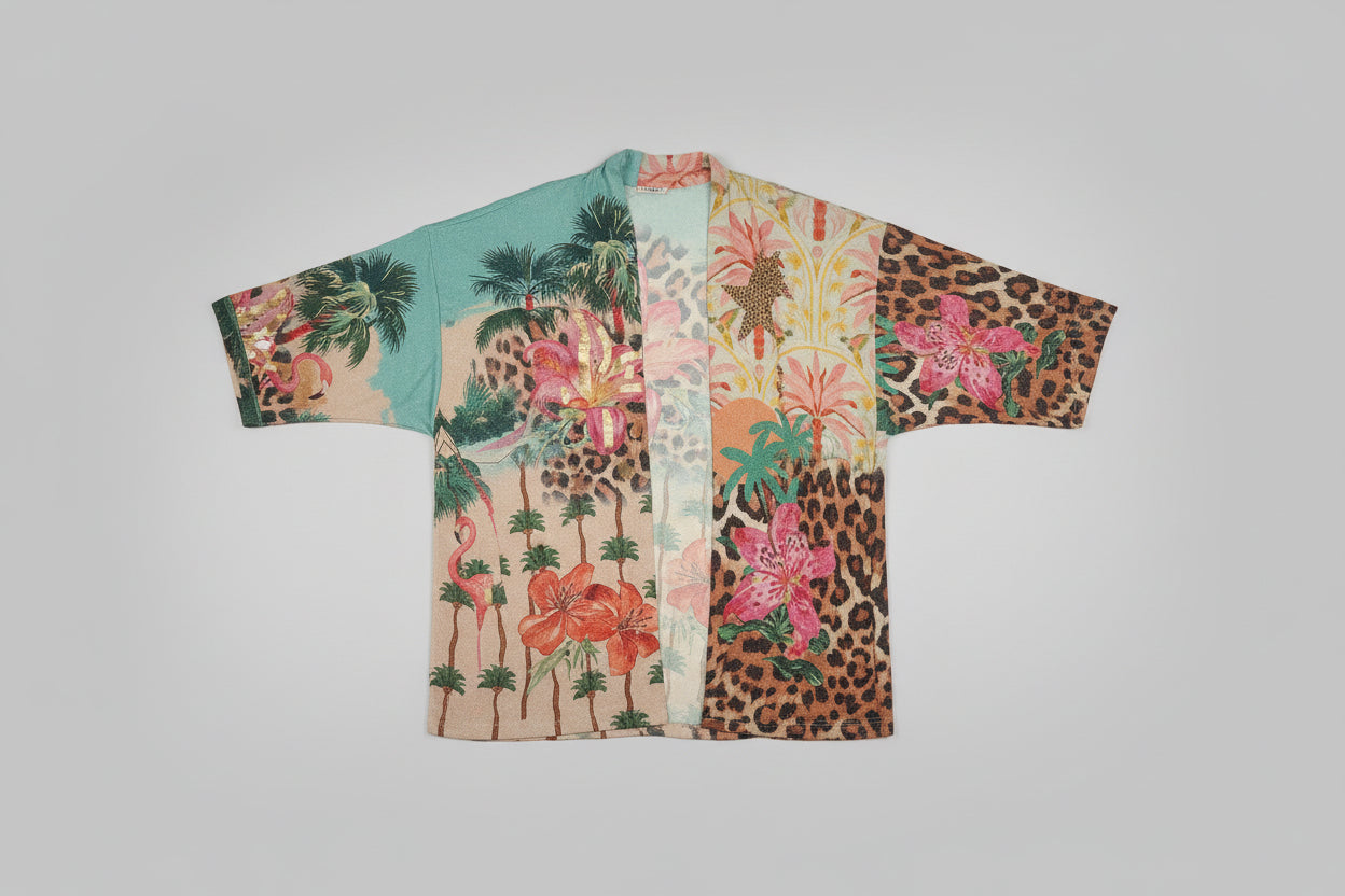Colorful shirt with floral and leopard print patterns on a gray background