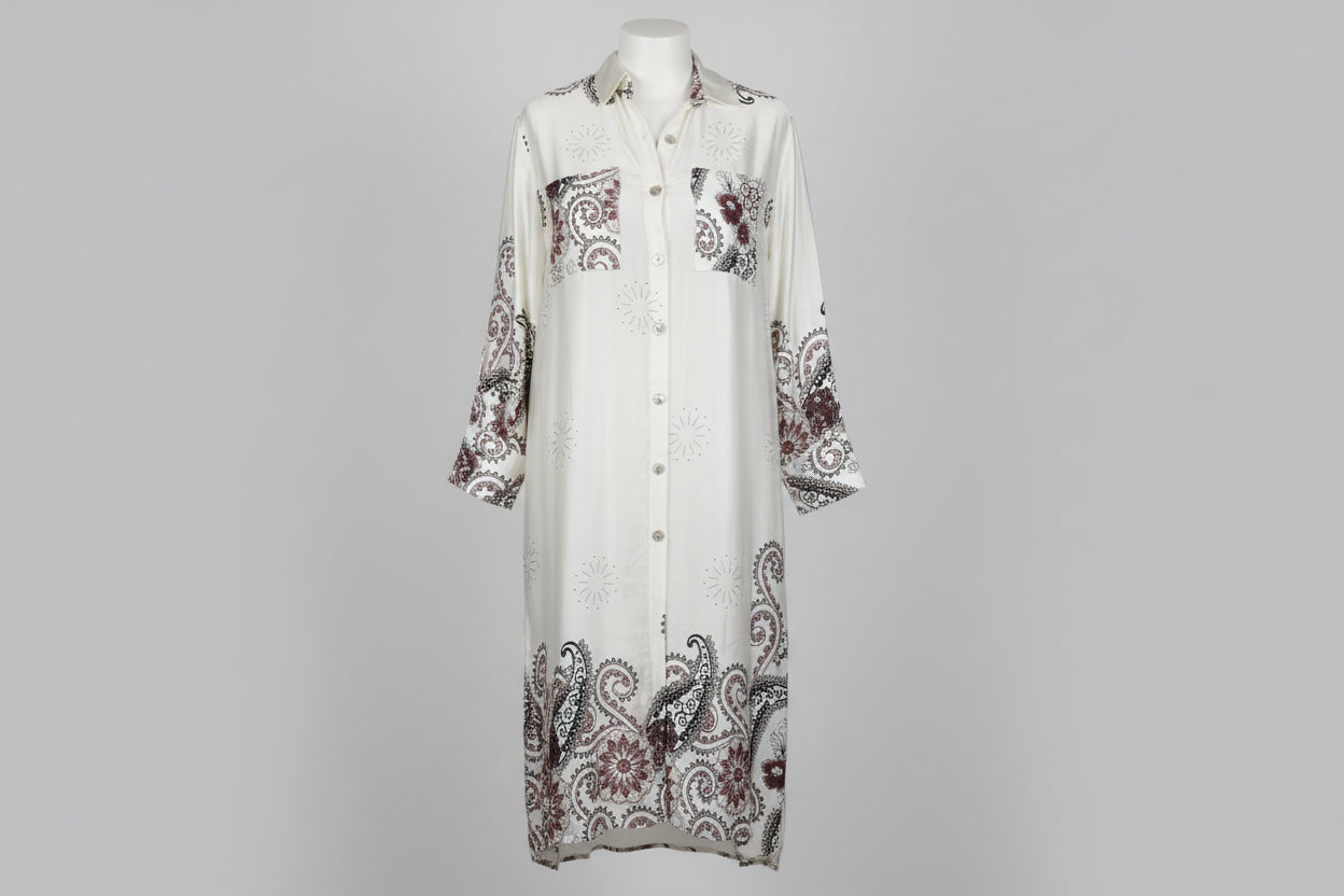 White dress with paisley patterns on a gray background