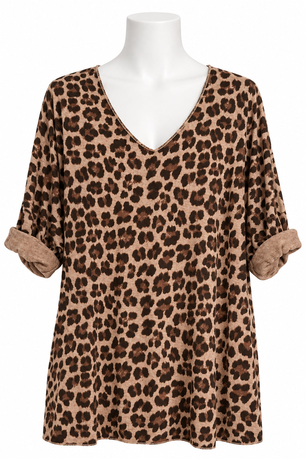 A leopard print short-sleeve top hanging on a black hanger against a white paneled wall. The top features a brown and beige animal print pattern with a V-neckline and a small brand label visible inside the collar.