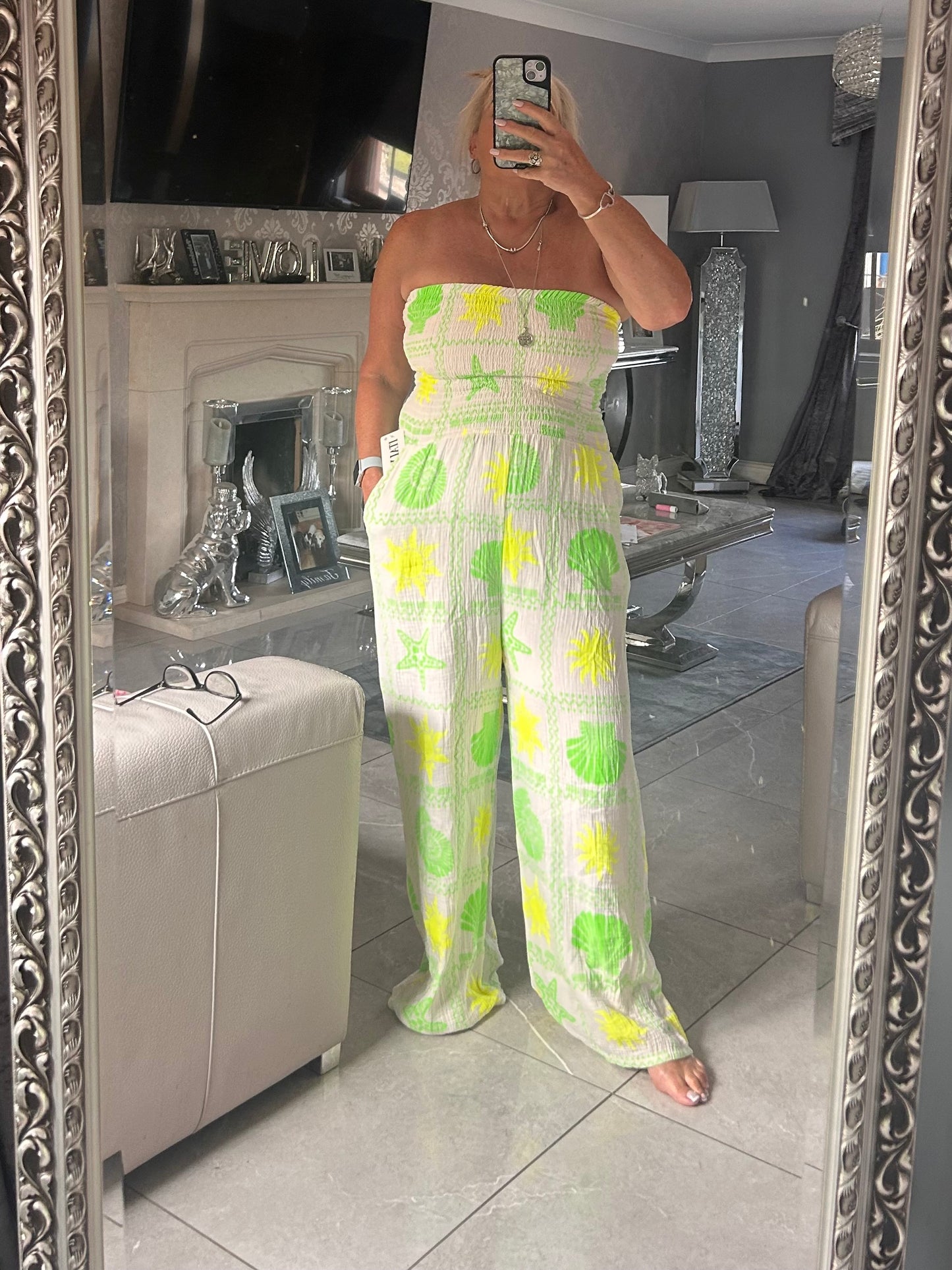 women wearing a shelly jumpsuit taking a selfie