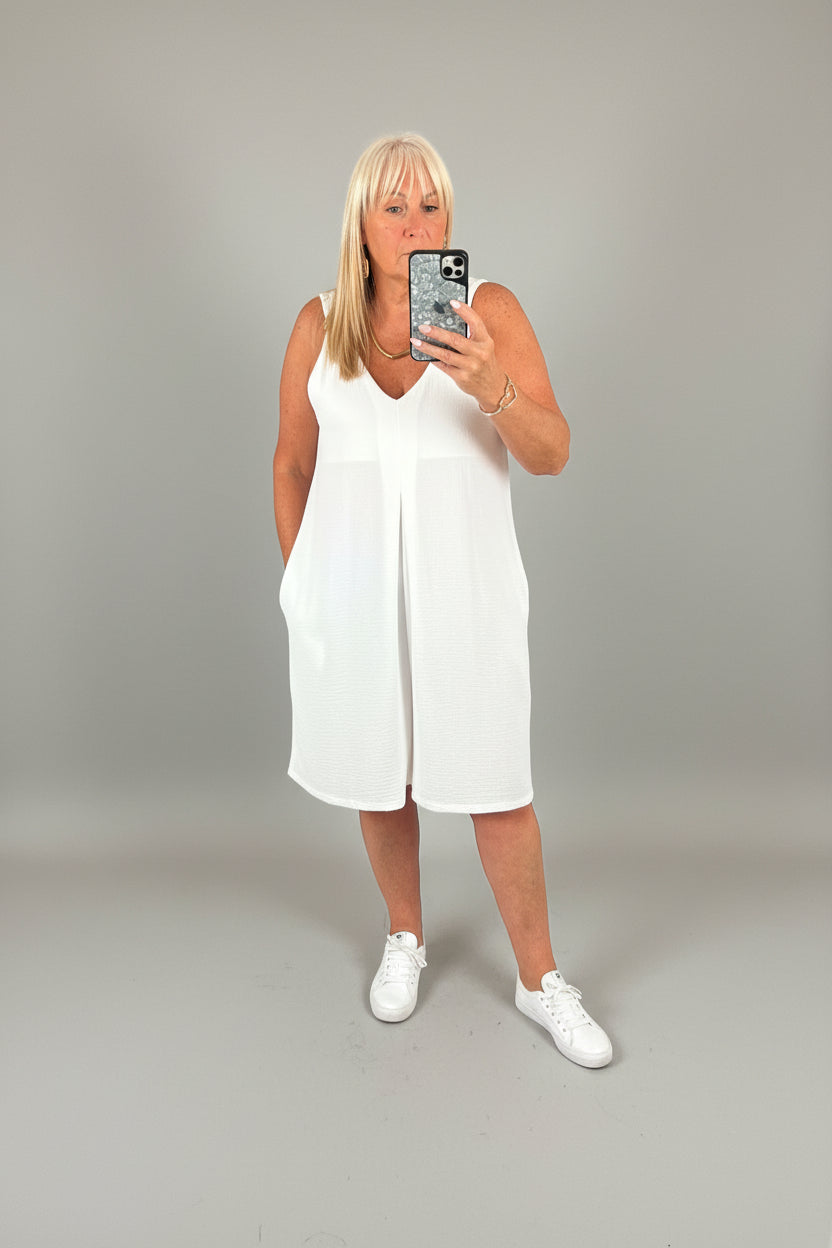 model wearing jade playsuit taking selfie